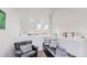 Cozy loft seating area with skylights, leather chair, and comfortable bench at 6503 Big Horn Trl, Littleton, CO 80125