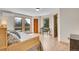 Bright bedroom featuring hardwood floors and mountain views at 27100 Molly Dr, Conifer, CO 80433