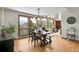 Dining room featuring mountain views, hardwood floors and stylish light fixture at 27100 Molly Dr, Conifer, CO 80433
