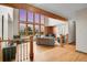 Open living area featuring hardwood floors, soaring ceilings, and mountain views at 27100 Molly Dr, Conifer, CO 80433