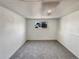 Finished basement with neutral carpet and a bright window adding natural light at 6189 Pontiac St, Commerce City, CO 80022