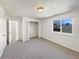 Bedroom with a double closet and a sun filled window at 6189 Pontiac St, Commerce City, CO 80022