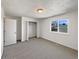 Bedroom with a double closet and a window with views at 6189 Pontiac St, Commerce City, CO 80022