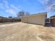 Detached two car garage with a large parking pad at 6189 Pontiac St, Commerce City, CO 80022