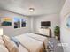 Serene bedroom featuring soft lighting, a plush rug, and minimalist decor, creating a relaxing retreat at 6189 Pontiac St, Commerce City, CO 80022
