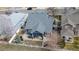 Aerial view of backyard featuring vinyl fence, landscaping, and concrete patio at 319 Mountain View Ave, Fort Lupton, CO 80621