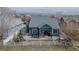 Outdoor view of backyard features concrete patio, landscaping, and partial fence at 319 Mountain View Ave, Fort Lupton, CO 80621