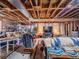 Unfinished basement with storage and lighting at 319 Mountain View Ave, Fort Lupton, CO 80621