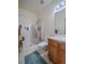 Bright bathroom featuring a shower, toilet, vanity, and light fixtures at 319 Mountain View Ave, Fort Lupton, CO 80621