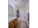 Standard bathroom featuring shower/tub combo, toilet, and wooden vanity at 319 Mountain View Ave, Fort Lupton, CO 80621