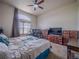 Spacious bedroom with natural light from a large window and a ceiling fan at 319 Mountain View Ave, Fort Lupton, CO 80621