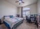 Bright bedroom with a large bed, a window, and neutral colored walls at 319 Mountain View Ave, Fort Lupton, CO 80621