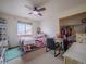 Bright bedroom with a large window and closet with clothing at 319 Mountain View Ave, Fort Lupton, CO 80621