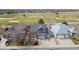 Suburban home with a lawn, driveway and a beautiful golf course view at 319 Mountain View Ave, Fort Lupton, CO 80621