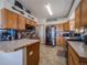 Functional kitchen with stainless steel appliances and breakfast bar at 319 Mountain View Ave, Fort Lupton, CO 80621