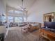 Inviting living room with tall arched windows, comfortable seating, and stylish decor at 319 Mountain View Ave, Fort Lupton, CO 80621