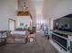 Inviting living room with fireplace, tall ceilings, and lots of natural light at 319 Mountain View Ave, Fort Lupton, CO 80621