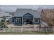 Backyard patio with awning and partial vinyl fence at 319 Mountain View Ave, Fort Lupton, CO 80621