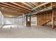 Unfinished basement with high ceilings and ample space at 14240 Ivanhoe St, Thornton, CO 80602
