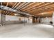 Unfinished basement with high ceilings and ample space at 14240 Ivanhoe St, Thornton, CO 80602