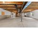 Unfinished basement with high ceilings and ample space at 14240 Ivanhoe St, Thornton, CO 80602