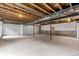 Unfinished basement with high ceilings and ample space at 14240 Ivanhoe St, Thornton, CO 80602