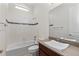 Clean bathroom, featuring a tub, toilet and modern vanity at 14240 Ivanhoe St, Thornton, CO 80602