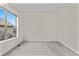 Bright and airy bedroom with large window and neutral carpeting at 14240 Ivanhoe St, Thornton, CO 80602
