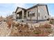 House exterior showcasing landscaping and stone accents at 14240 Ivanhoe St, Thornton, CO 80602