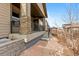 Ranch style home with stone accents and a covered porch at 14240 Ivanhoe St, Thornton, CO 80602