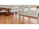 Open concept kitchen with hardwood floors and island at 14240 Ivanhoe St, Thornton, CO 80602