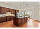 Open kitchen with large island and stainless steel appliances at 14240 Ivanhoe St, Thornton, CO 80602