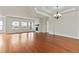 Spacious living room featuring hardwood floors and a cozy fireplace at 14240 Ivanhoe St, Thornton, CO 80602