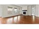 Spacious living room with hardwood floors, fireplace and large windows at 14240 Ivanhoe St, Thornton, CO 80602