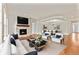 Spacious living room with hardwood floors and a fireplace at 14240 Ivanhoe St, Thornton, CO 80602
