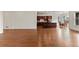 Bright and airy living room with hardwood floors and kitchen views at 14240 Ivanhoe St, Thornton, CO 80602