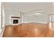Living room with hardwood floors, fireplace and views to dining room at 14240 Ivanhoe St, Thornton, CO 80602