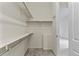 Large walk-in closet with ample shelving and hanging space at 14240 Ivanhoe St, Thornton, CO 80602