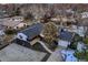 Beautiful aerial view of the home featuring landscaping, backyard, and a detached two-car garage at 3318 S Dayton Ct, Denver, CO 80231