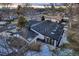 A picturesque view of a modern home featuring a well-maintained roof with skylights at 3318 S Dayton Ct, Denver, CO 80231