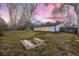 Large backyard displaying lush grass and an in-ground area for outdoor recreation like horseshoes at 3318 S Dayton Ct, Denver, CO 80231