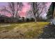 Wide, fully fenced backyard showing ample green space and mature trees enhancing privacy at 3318 S Dayton Ct, Denver, CO 80231
