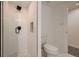 Modern bathroom features a luxurious walk-in shower with elegant tile work and updated fixtures at 3318 S Dayton Ct, Denver, CO 80231