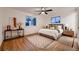 Serene bedroom with hardwood floors, natural light, and neutral color palette at 3318 S Dayton Ct, Denver, CO 80231