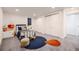 Well-lit bedroom with plush carpeting, modern furnishings, and convenient closet space at 3318 S Dayton Ct, Denver, CO 80231