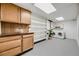 Functional laundry room featuring ample storage cabinets and shelving, along with modern washer and dryer at 3318 S Dayton Ct, Denver, CO 80231