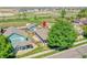 Aerial view of a blue single-Gathering home, showcasing the fenced backyard and neighborhood at 2791 Quarterland St, Strasburg, CO 80136