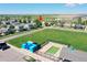 Aerial view of house in relation to community pool at 2791 Quarterland St, Strasburg, CO 80136