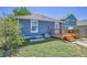 Image of the backyard, highlighting the wooden deck and fenced yard at 2791 Quarterland St, Strasburg, CO 80136