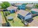 Aerial view of a fenced backyard featuring a detached garage, deck, and trampoline at 2791 Quarterland St, Strasburg, CO 80136